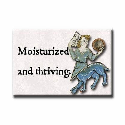 Medieval marginalia illustration of a half-person, half-dog, accompanied by the text 'Moisturized and thriving.'